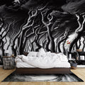 Black and white forest wallpaper creating depth in a modern living room with minimalist furniture