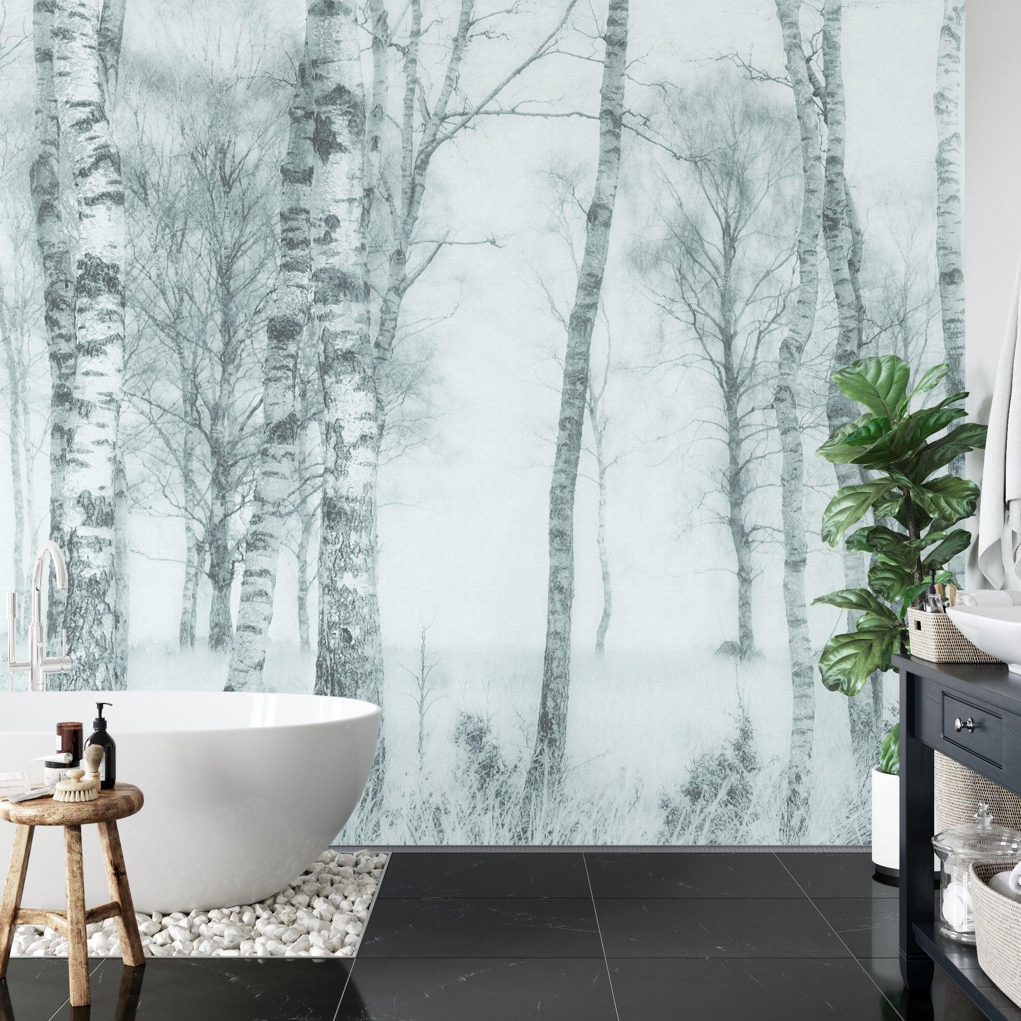 Black and white forest wallpaper creating depth in modern living room with minimal furniture