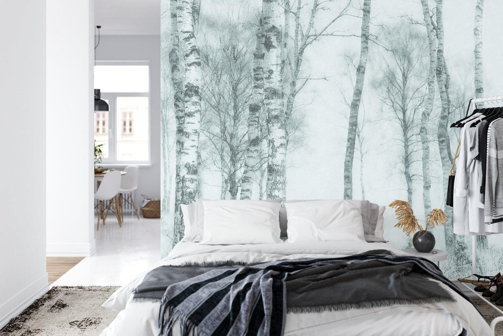 Monochrome birch tree mural adding character to bedroom wall behind bed