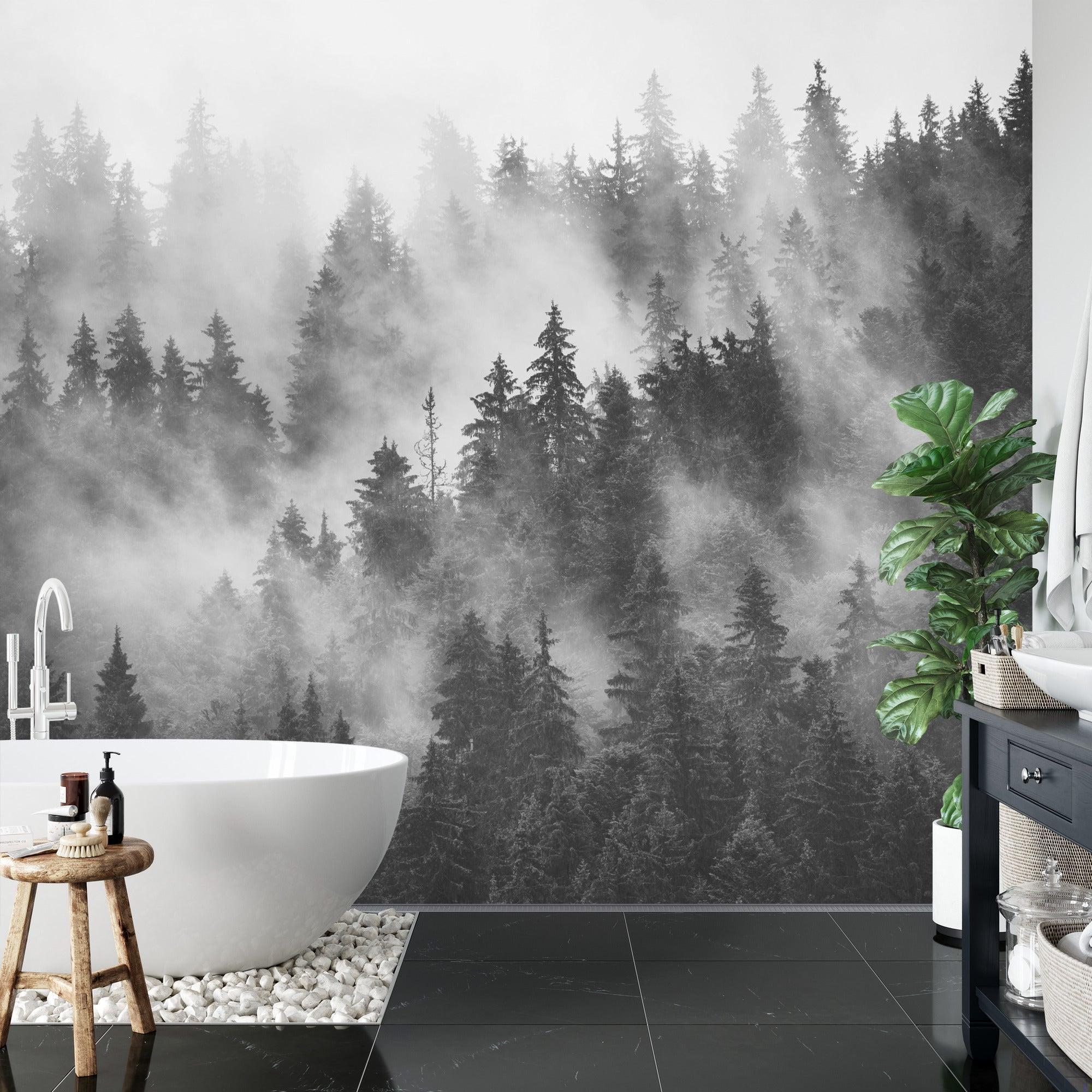 Black and white forest wallpaper creating depth in a minimal Scandinavian living room