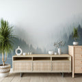 Misty forest wallpaper creating depth in a modern living room, pine trees emerging through gentle grey fog
