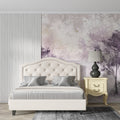 Purple forest wallpaper with gold accents creating depth in a modern living room with natural light