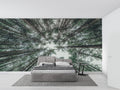 Forest canopy wallpaper creating depth in a modern living room with high ceilings