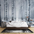 Winter forest wallpaper creating a cozy atmosphere in a modern living room, white birch trees adding depth to the space