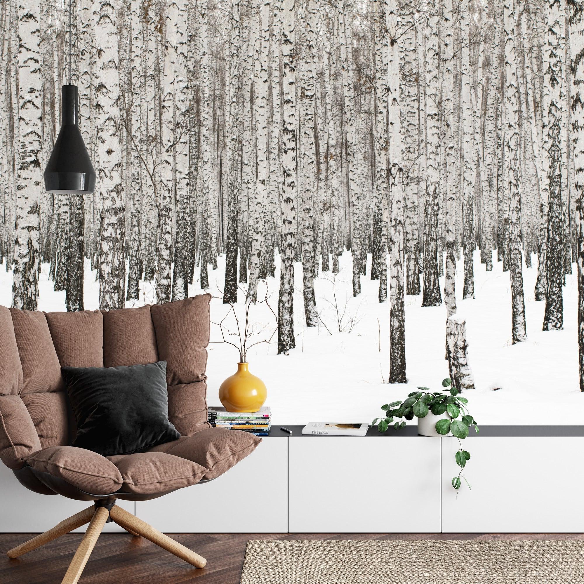 Snowy birch tree mural adding depth to a minimalist bedroom with grey accents