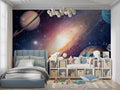 Galaxy space wallpaper in modern kids bedroom with floating bed and LED lights