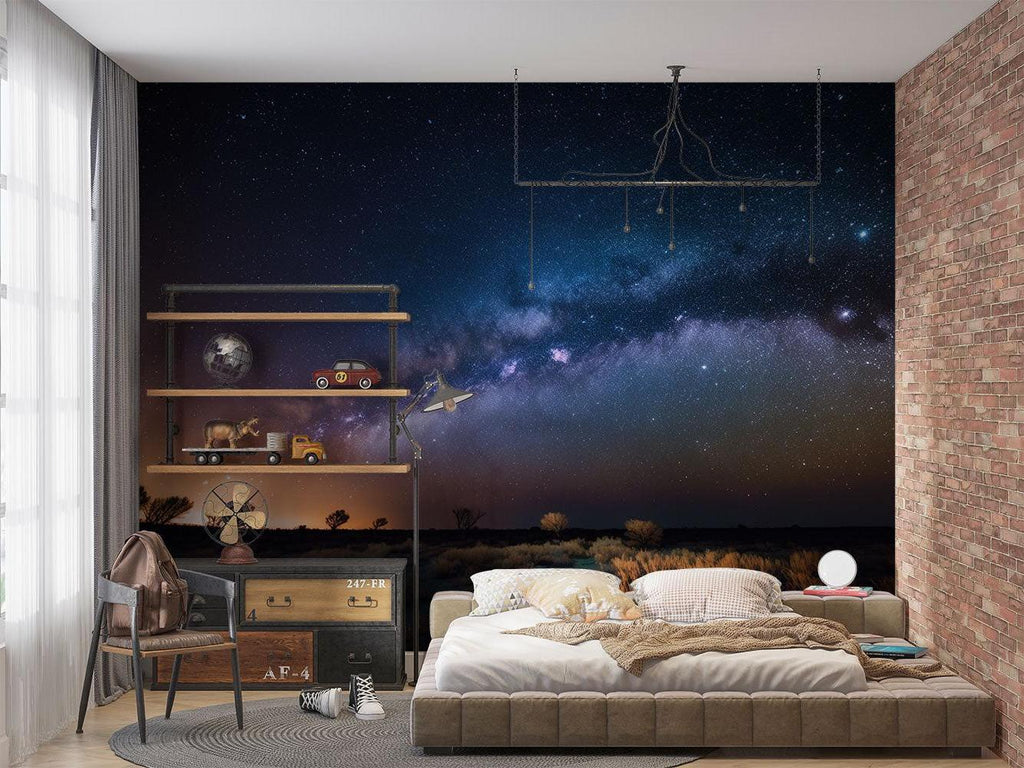 Night sky mural creating depth in a minimalist home office space