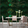 Geometric green and gold wallpaper in modern dining room, creating depth with art deco pattern
