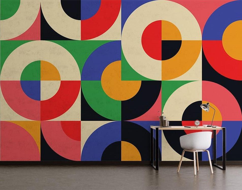 Bauhaus-inspired geometric wallpaper making a statement in a minimalist home office