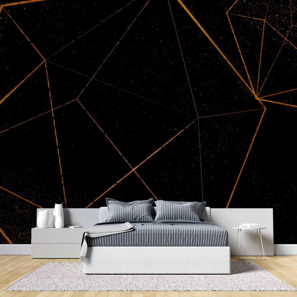 Black and gold geometric pattern wallpaper in a luxury hotel lobby showing scale and impact