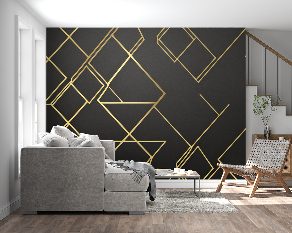 Geometric black and gold diamond wallpaper in modern living room with grey sofa