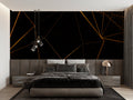 Black and gold geometric wallpaper in modern living room with tall windows and grey sofa