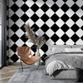 Black and white geometric diamond wallpaper in a modern living room creating a stunning focal wall