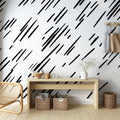 Black geometric line pattern wallpaper in a modern minimalist living room with natural light and contemporary furniture