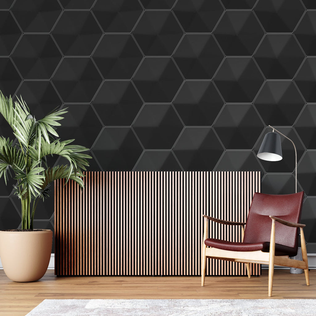 Black geometric wallpaper in modern living room showing 3D hexagon pattern casting subtle shadows on feature wall