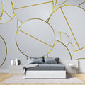 Gold geometric wallpaper in modern living room, showing circular patterns catching natural light