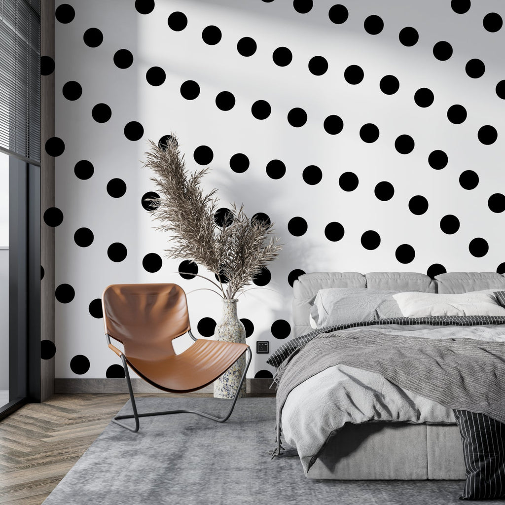 Geometric gold dot wallpaper as bedroom feature wall adding warm, sophisticated touch
