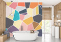 Modern Geometric Mosaic Wallpaper brightening a minimalist living room with its vibrant colors and abstract patterns