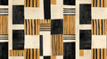 Modern geometric black and gold wallpaper in a stylish dining room setting with contemporary furniture