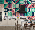 Modern geometric wallpaper with pink and green art deco pattern styled in a bright contemporary living room