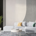 Modern geometric line wallpaper creating depth in a minimalist living room with clean furniture and natural light