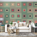 Geometric pattern wallpaper bringing modern style to a minimalist living room with sage and coral accents