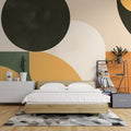 Modern geometric circle wallpaper in earth tones showcased in a minimalist Scandinavian living room with natural light