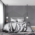 Modern grey geometric wallpaper in minimalist living room showing clean lines and contemporary design