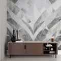 Grey geometric wallpaper mural creating depth in modern living room setting