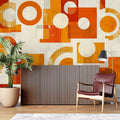 Modern geometric orange circle wallpaper in bright contemporary living room with grey sofa