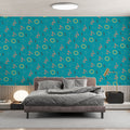 Modern geometric wallpaper in a bright home office space, showing coral and yellow pattern creating an energetic workspace atmosphere