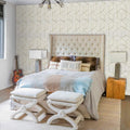 Modern geometric wallpaper in a bright Scandinavian living room with minimal furniture