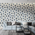 Modern geometric triangle wallpaper in blue tones bringing fresh style to a minimalist home office setup
