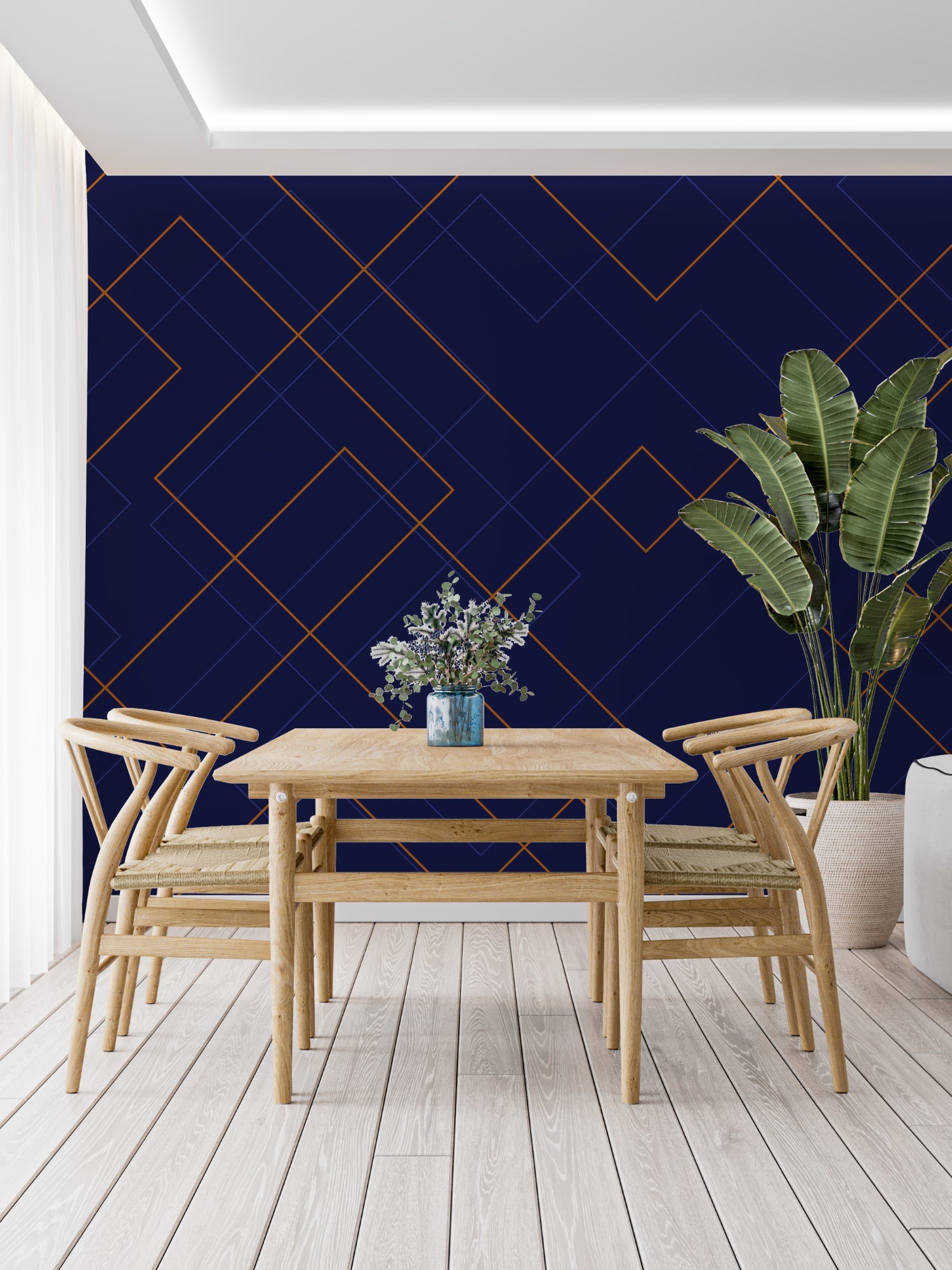 Navy blue and gold geometric wallpaper in modern living room with grey sofa and brass accents