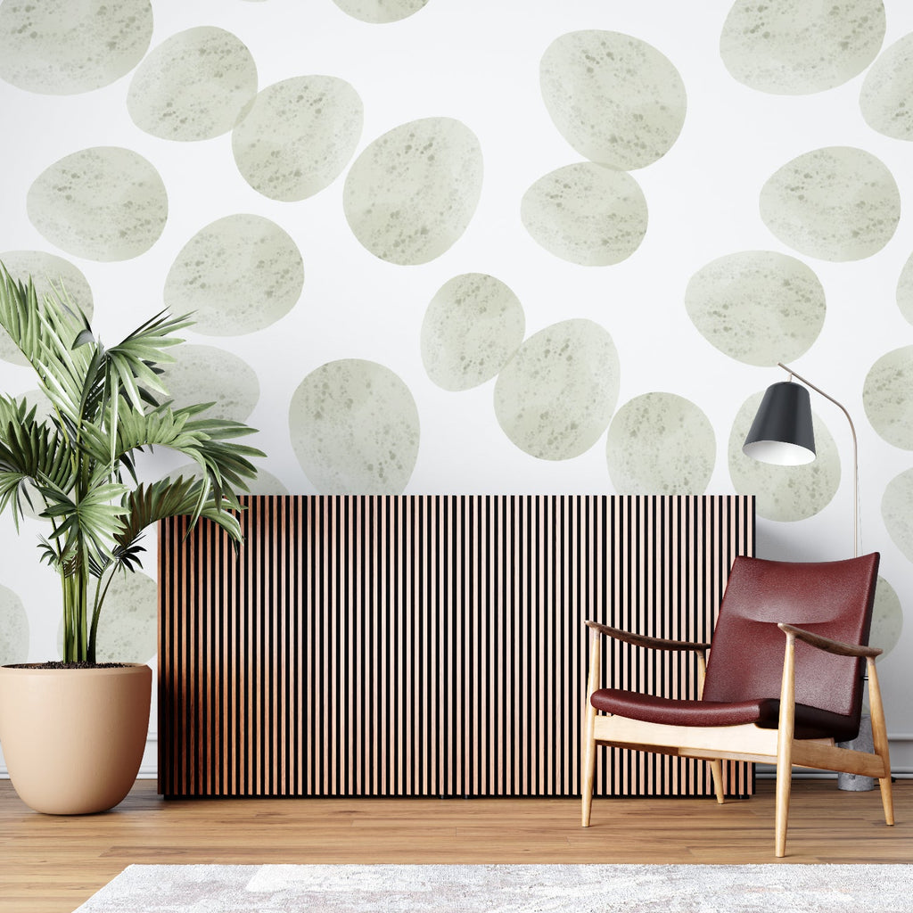 Sage green circle pattern wallpaper creating calm in a bright home office
