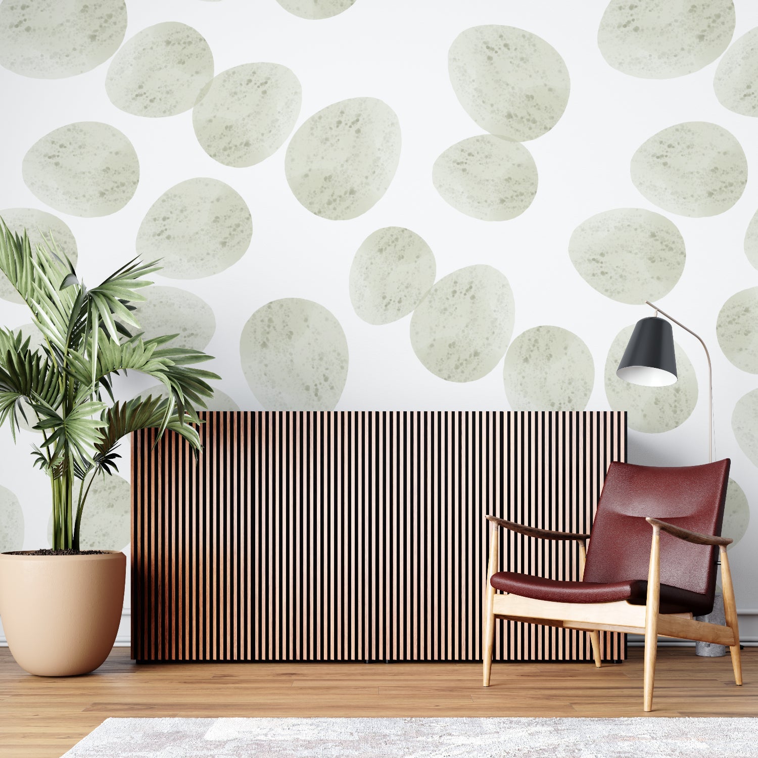 Sage green circle pattern wallpaper creating calm in a bright home office