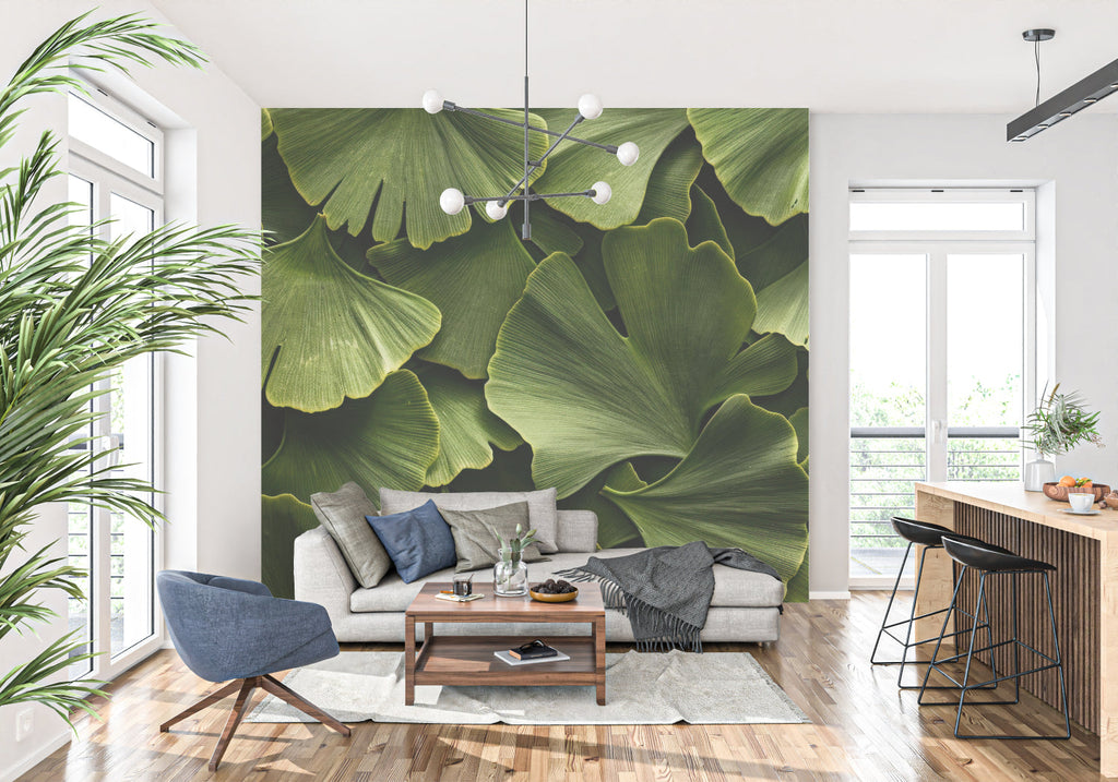 Green ginkgo leaf mural enhancing a minimalist dining room space