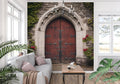 Gothic door mural wallpaper in a grand entrance hall, showing stone arch and red wooden door