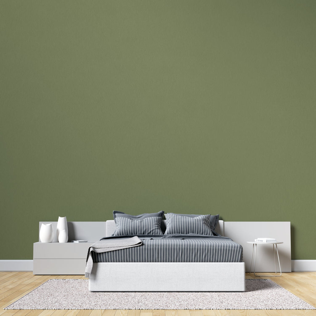 Modern green wall mural in bright living room showing peaceful khaki tones