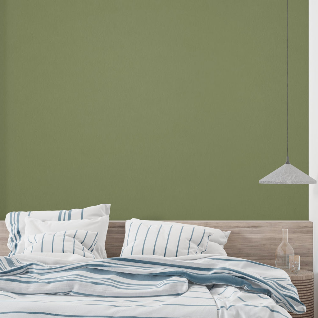 Modern olive green wallpaper in bright living room with minimalist furniture