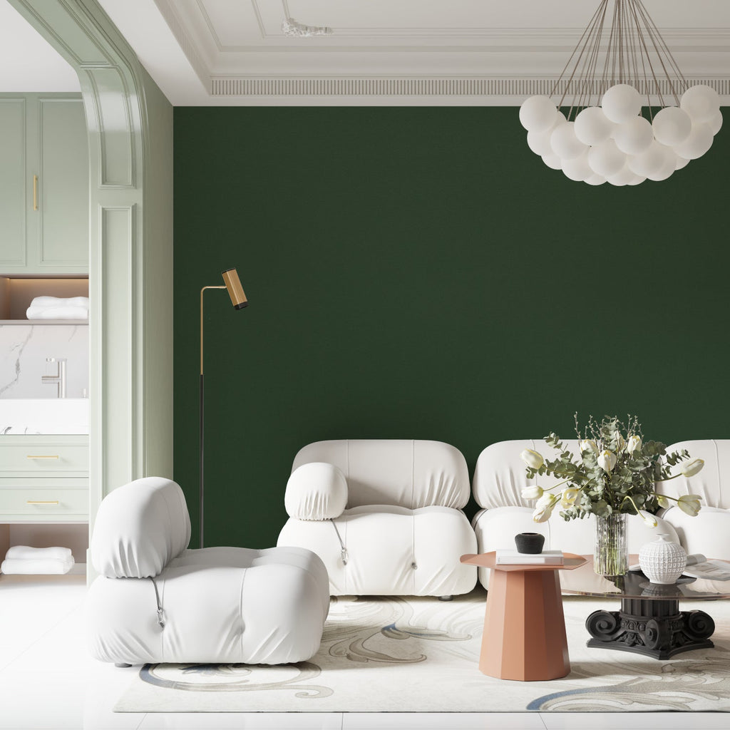 Modern emerald green wallpaper in a bright living room setting, showing how the solid color creates depth