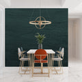 Green textured wallpaper in modern living room with minimal furniture and natural light