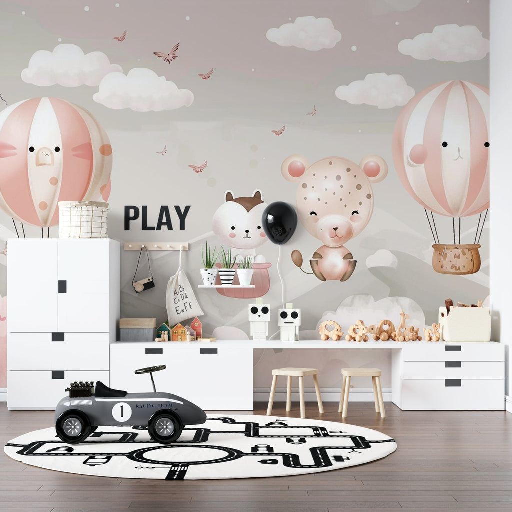 Pink hot air balloon mural creating a cozy reading nook in a kids bedroom