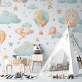Hot air balloon nursery wallpaper in a cozy nursery setting with soft lighting and gentle colors