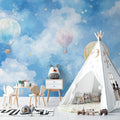 Hot air balloon wallpaper creating a dreamy atmosphere in a bright nursery with white furniture