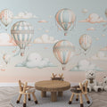 Hot air balloon nursery wallpaper creating a magical atmosphere in a cozy bedroom, with soft pastel colors and floating clouds