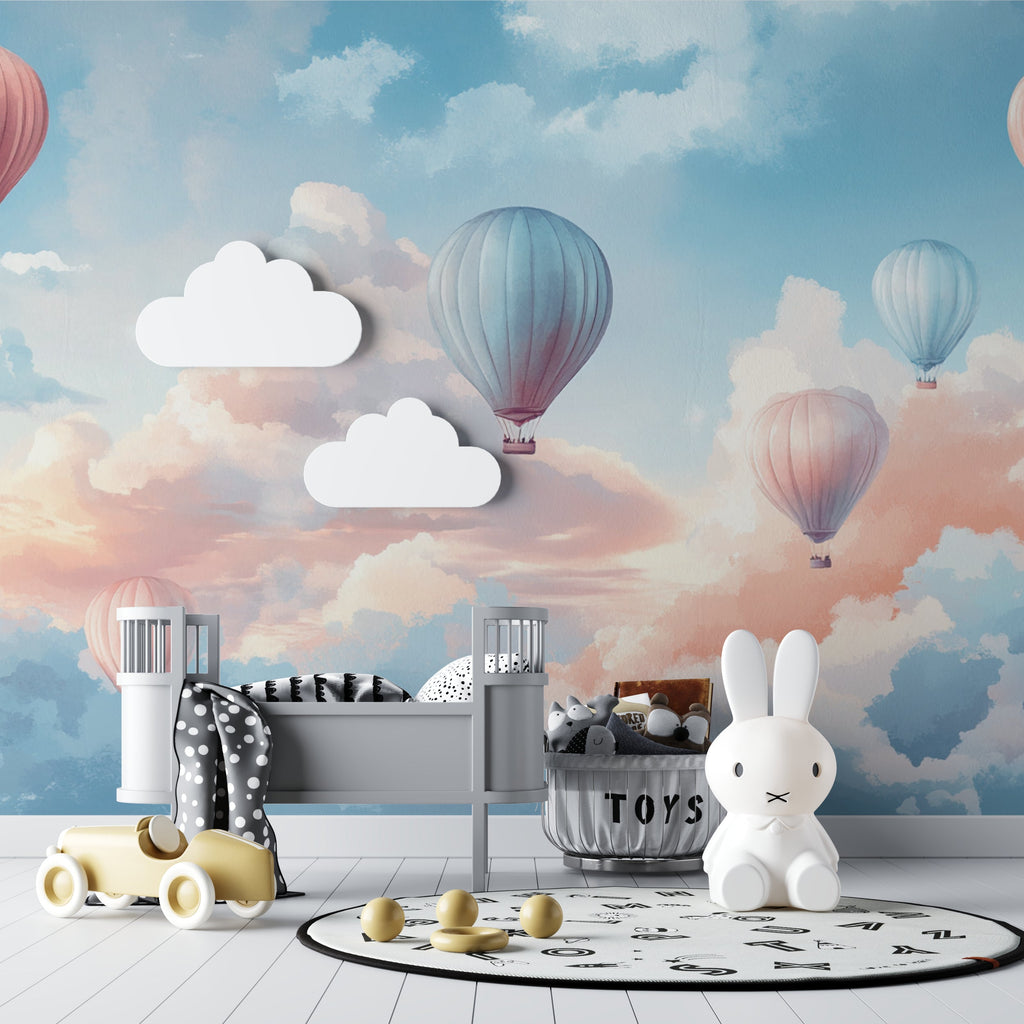 Hot air balloon nursery wallpaper in a bright modern nursery with white furniture