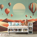 Hot air balloon wallpaper creating a dreamy atmosphere in a modern nursery with mint green and coral accents