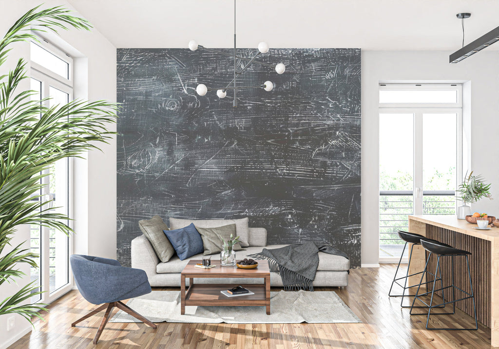 Industrial chalkboard wallpaper creating a modern statement wall in a minimalist living room