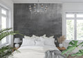 Industrial concrete wallpaper in modern minimalist living room with grey sofa and metal accents